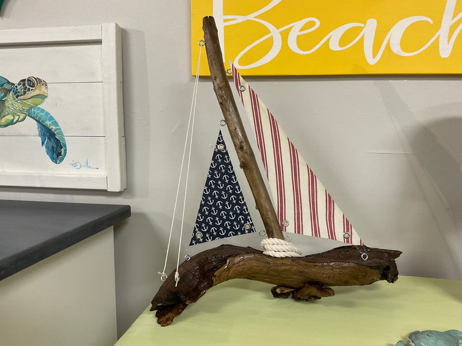 Driftwood sailboat with sails