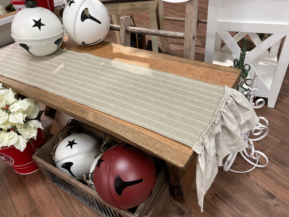 Tan striped ruffled table runner