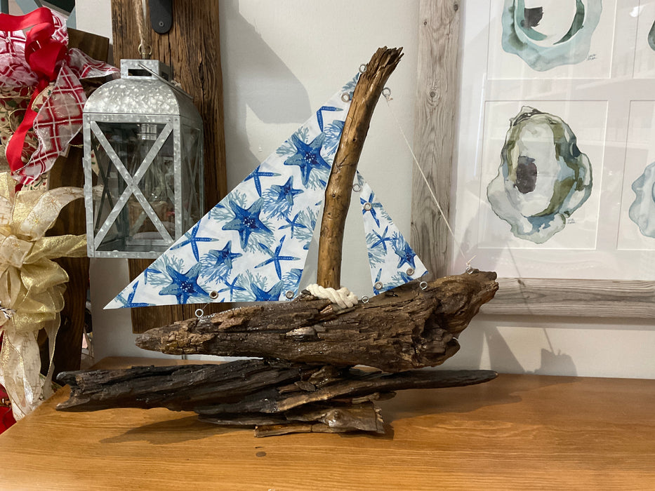 Driftwood sailboat with sails