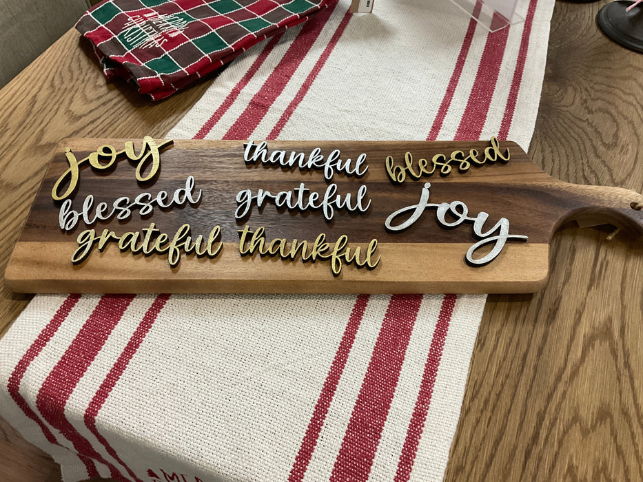 Cut-out wood plate words.