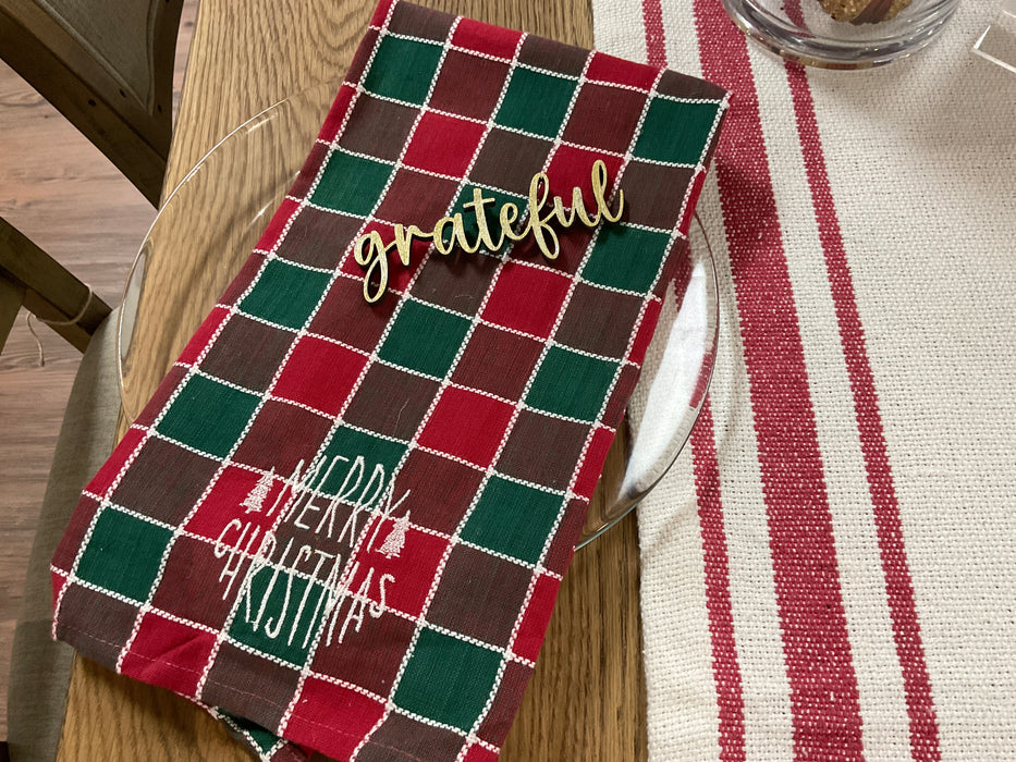 Cut-out wood plate words.