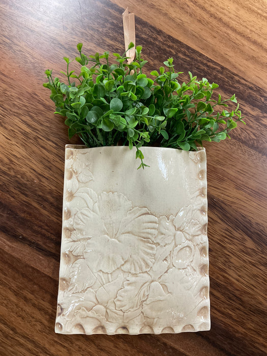 Embossed floral wall pocket