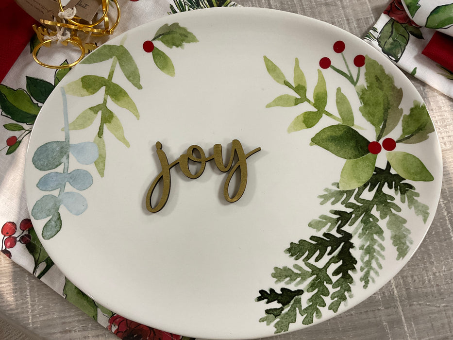Cut-out wood plate words.