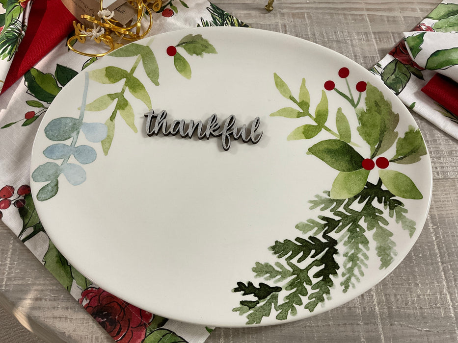 Cut-out wood plate words.