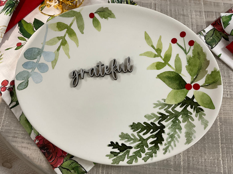 Cut-out wood plate words.