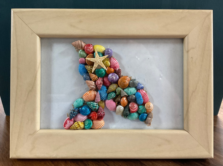 Framed whale tail shell art