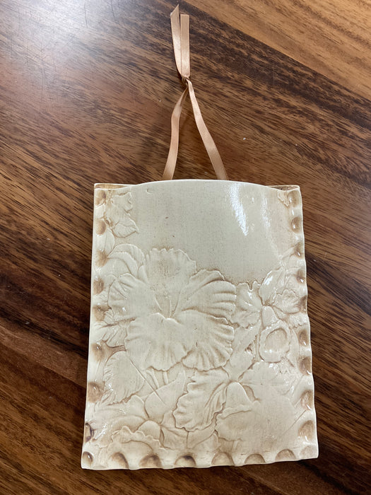 Embossed floral wall pocket