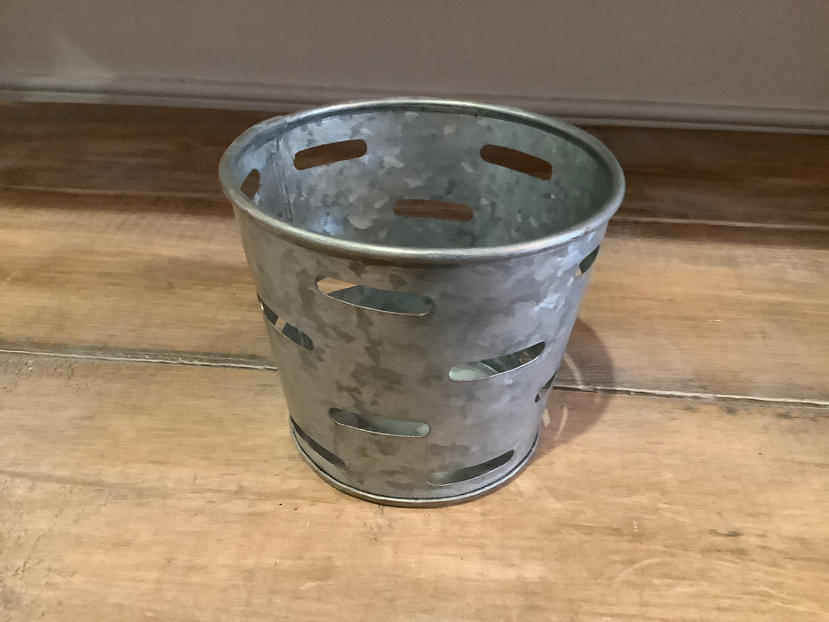 Slotted metal votive