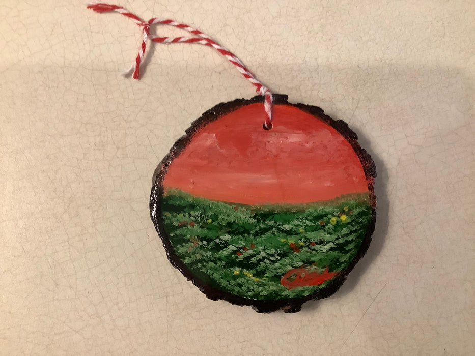 Painted tree cookie with epoxy ornament