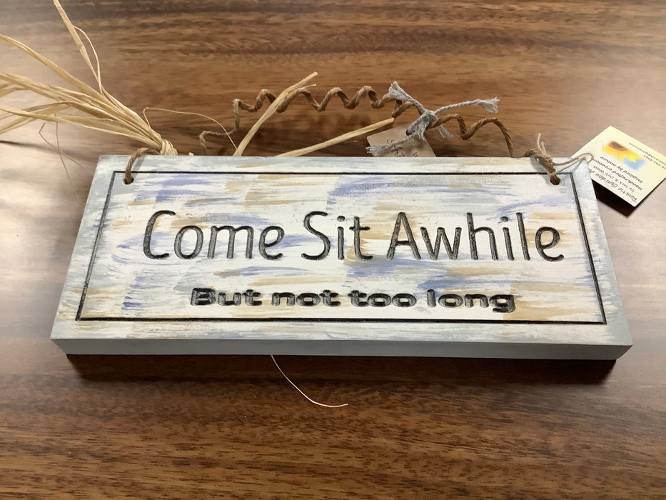 Come sit a while sign
