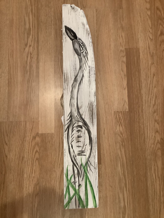 Painted egret on white board