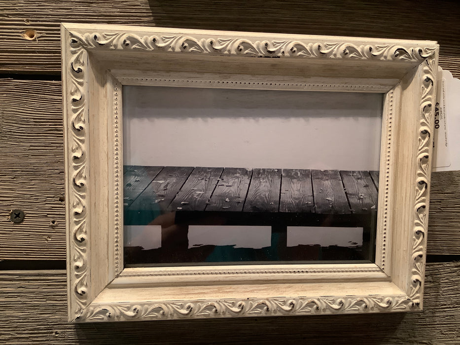 Black and white wood dock photo in frame