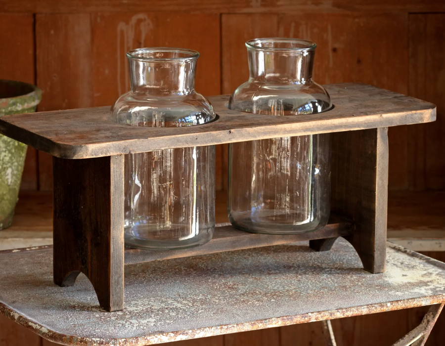Wooden flower stand glass bottles
