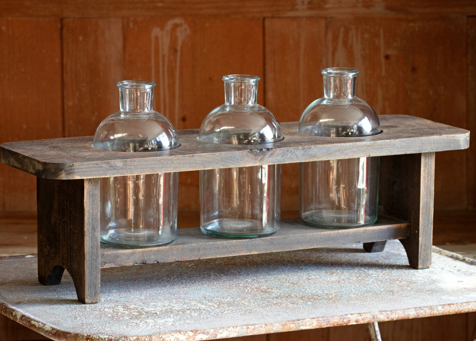 Wooden flower stand glass bottles
