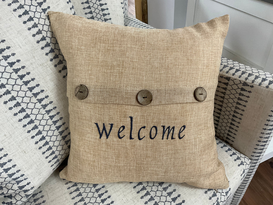 Three button tan Welcome pillow