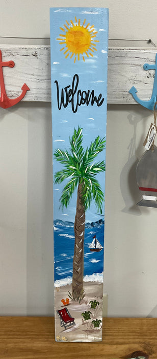 Welcome sign with palm tree