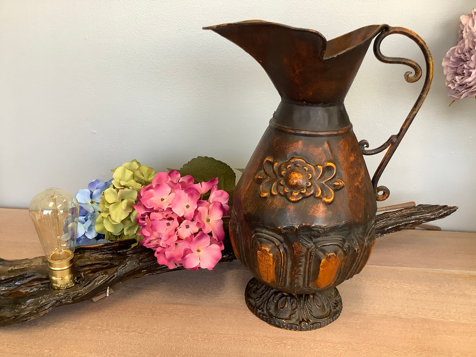 Metal vase with antique finish