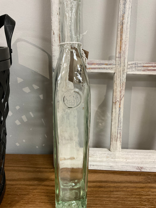 Tall skinny glass bottle