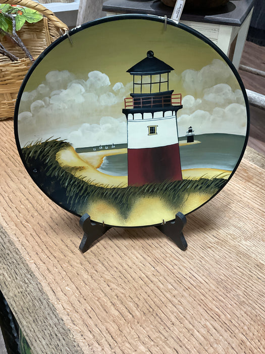 Lighthouse painted on plate