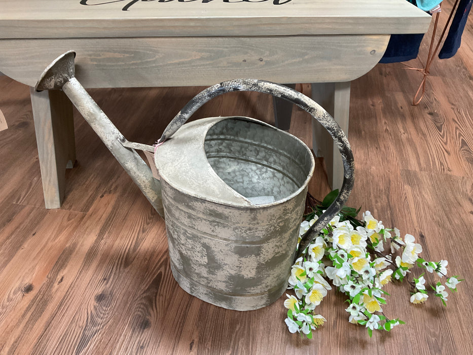 White distressed watering can