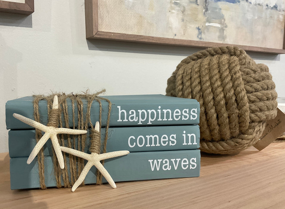 Book stack - happiness comes in waves