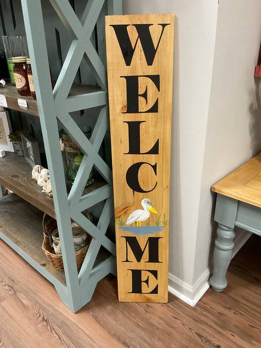 Welcome wood sign with pelican