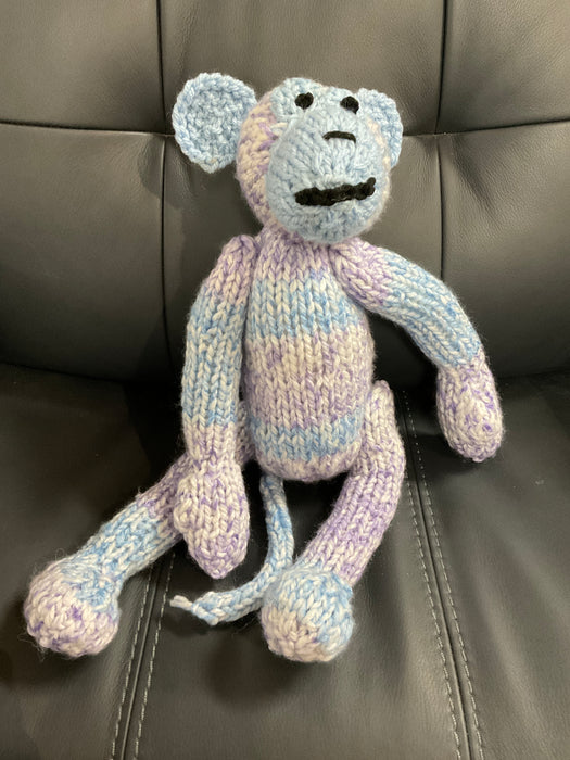 Hand knitted stuffed monkey