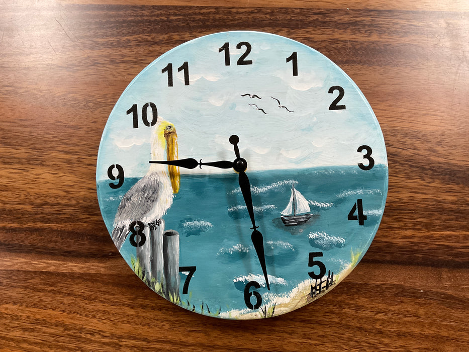 Round wood painted pelican clock