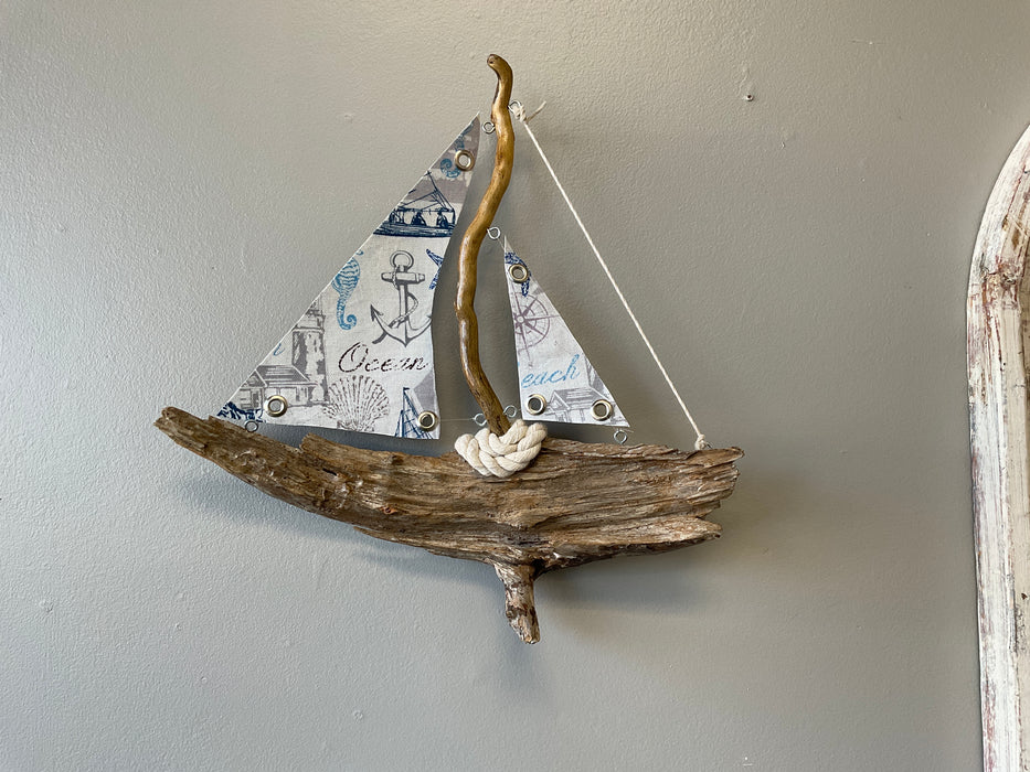 Driftwood sailboat with sails