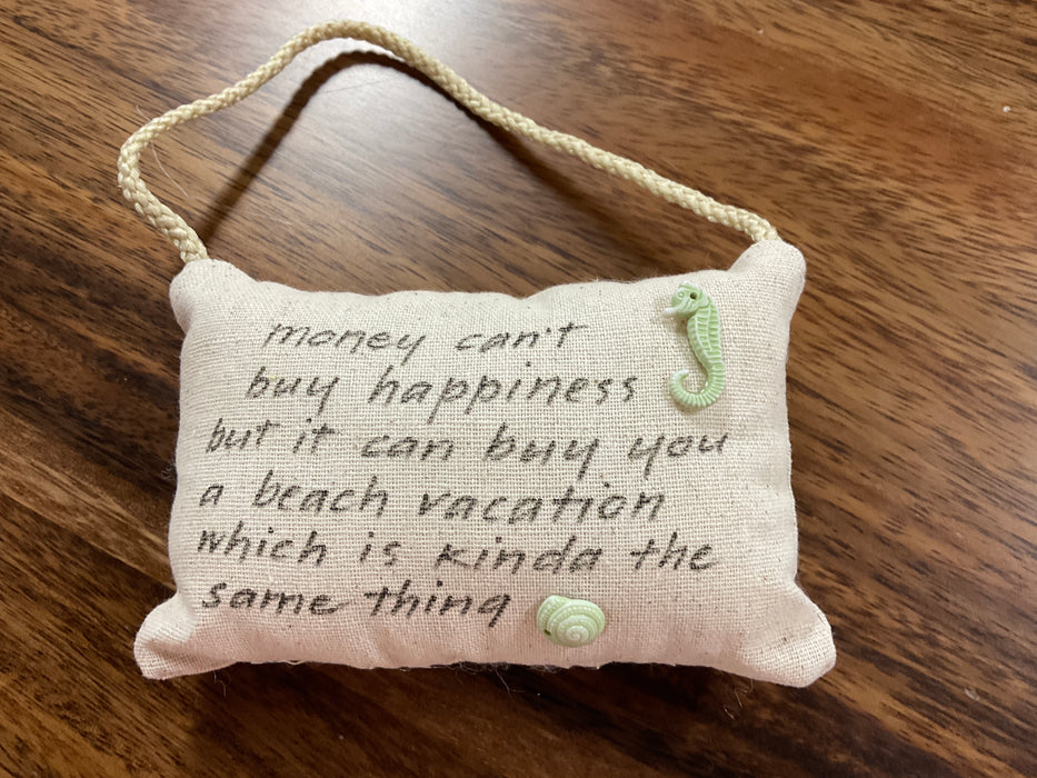 Hanging pillow with written phrase