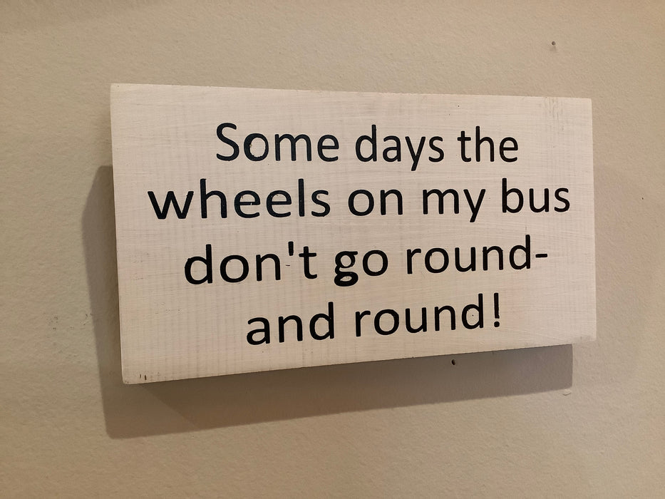 Funny wood sign - wheels on the bus
