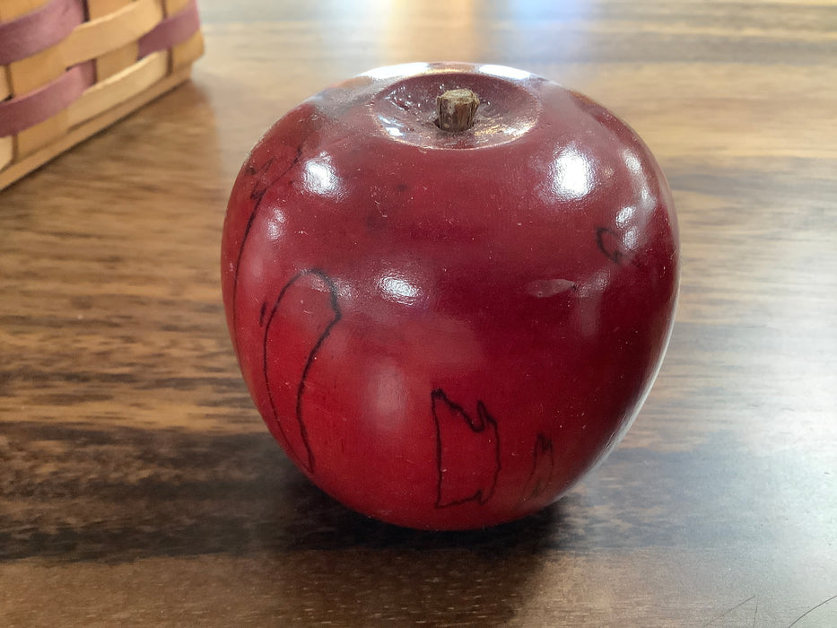 Carved wood red apple