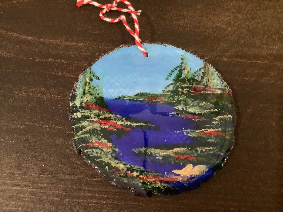 Painted tree cookie with epoxy ornament